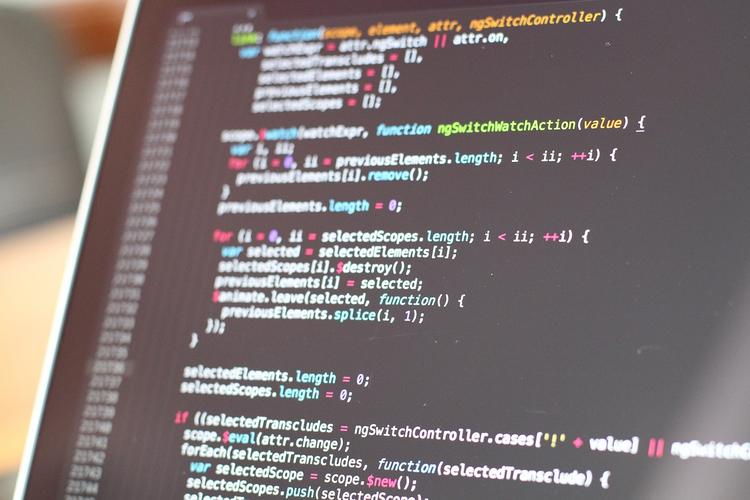 Developer working on cross-platform app optimization with multiple devices showing iOS, Android, and web versions of the same application