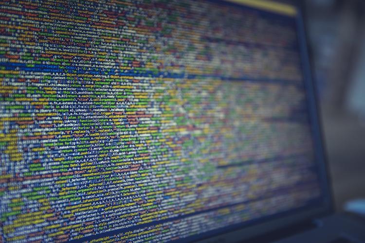 Digital security shield protecting application data with validation checkmarks and code patterns in background