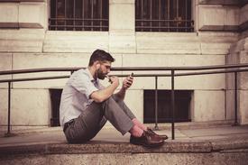 Person editing portrait photos for social media on smartphone