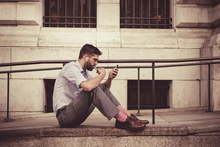Person editing portrait photos for social media on smartphone