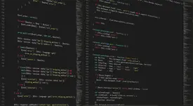 Developer debugging CSS code on multiple monitors showing shadow rendering issues and browser compatibility problems