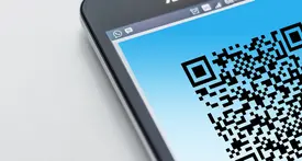 Smartphone displaying Facebook profile QR code with instant profile sharing interface