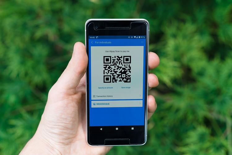 Business professional sharing digital business card via QR code on smartphone enabling instant contact information exchange