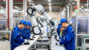 Humanoid Robots Working in Factories 2026 Humanoid robot working alongside human workers on factory assembly line
