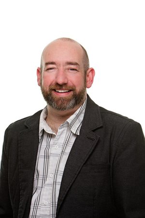 Professional business headshot with clean white background