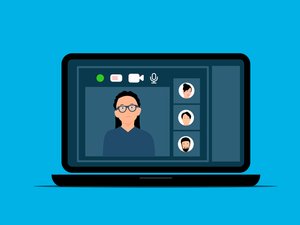 Diverse remote team collaborating through video conference with translation