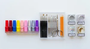 A creative workspace showing various inspiration sources like fabric swatches and color palettes alongside AI generated nail art designs