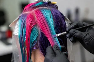 Close-up of vibrant hair color application process