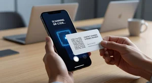 Smartphone scanning custom branded QR code on business card