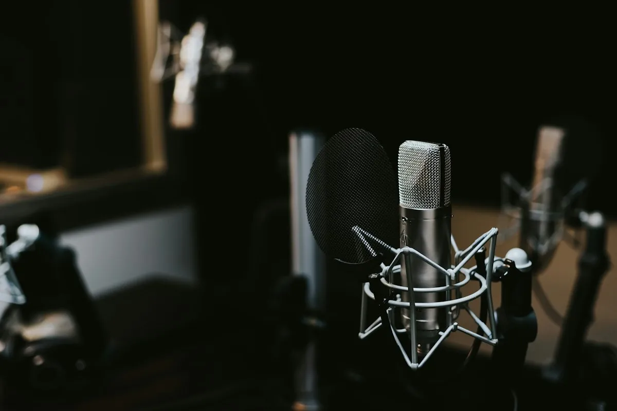 Modern video editing workspace with AI voiceover software interface on screen