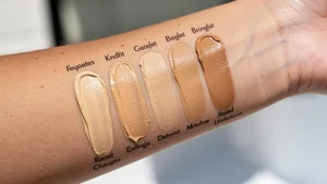 Close-up of foundation shade swatches showing various undertones on skin