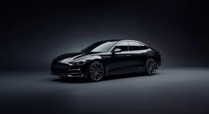 Sedan car isolated on dramatic dark gradient background for professional automotive advertising photography with studio lighting effect